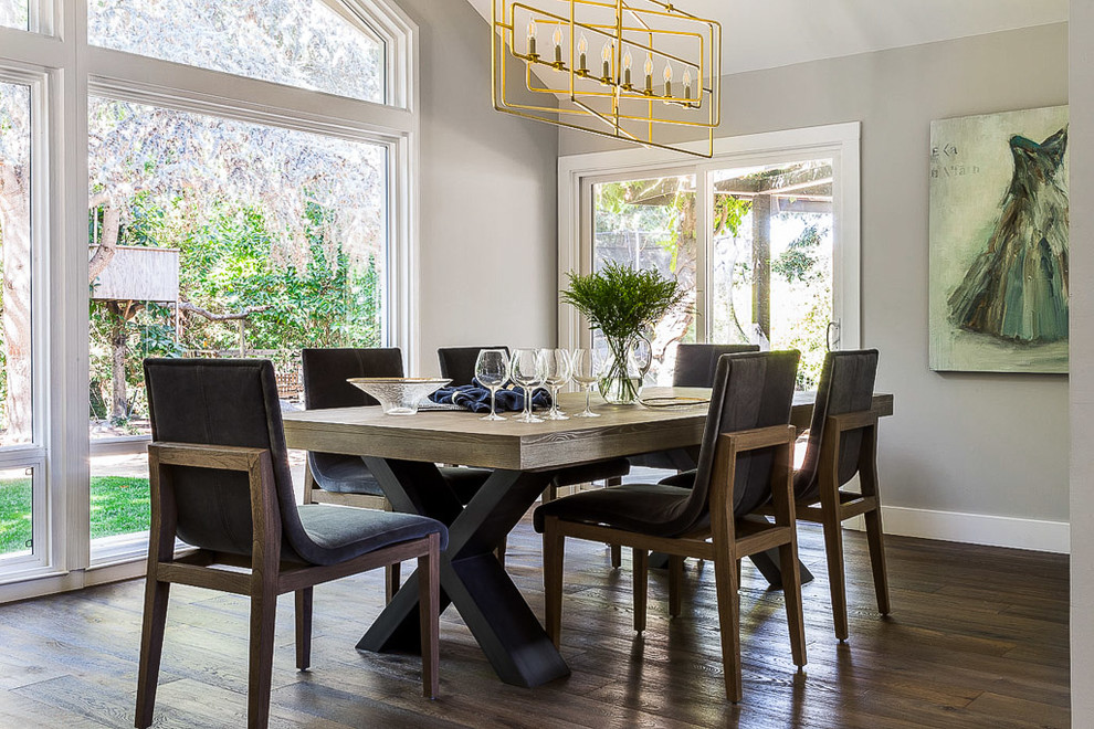 Transitional dining room in San Francisco with grey walls, dark hardwood floors and brown floor.