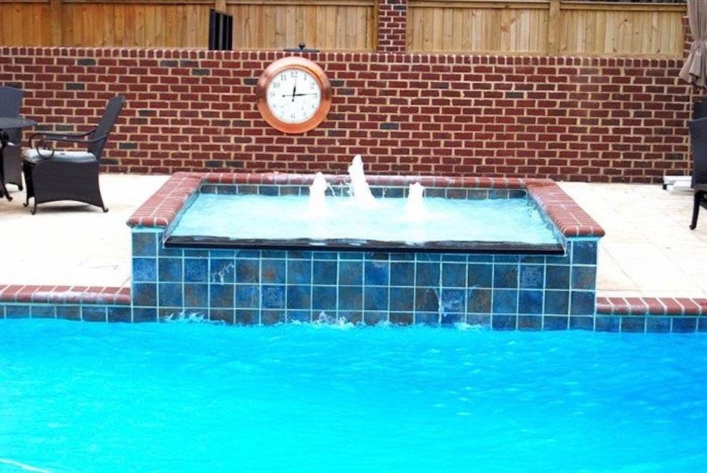 Mid-sized backyard stone and rectangular natural pool fountain photo