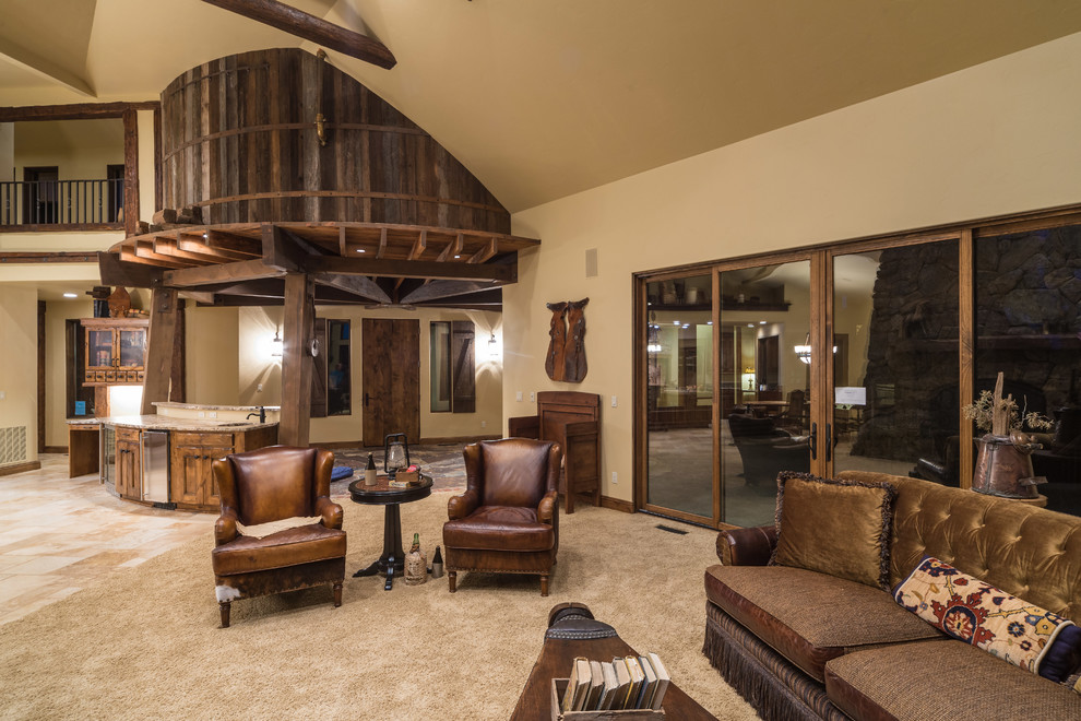 Large country open concept living room in Other with carpet, a standard fireplace and a stone fireplace surround.