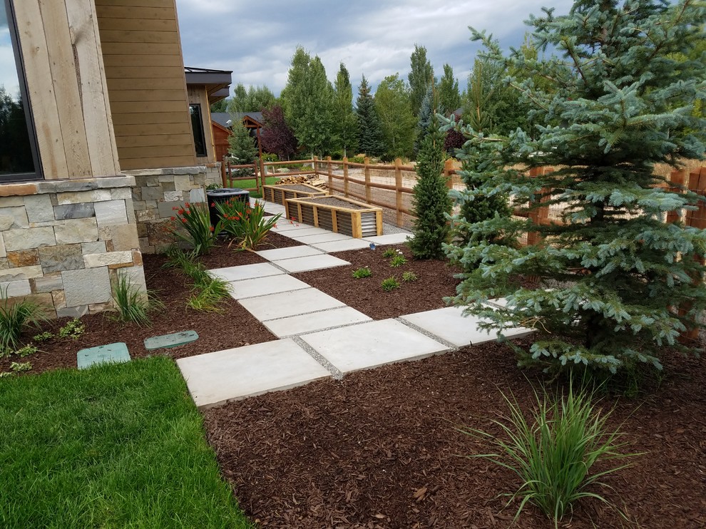 Design ideas for a large modern side yard garden in Salt Lake City with concrete pavers.