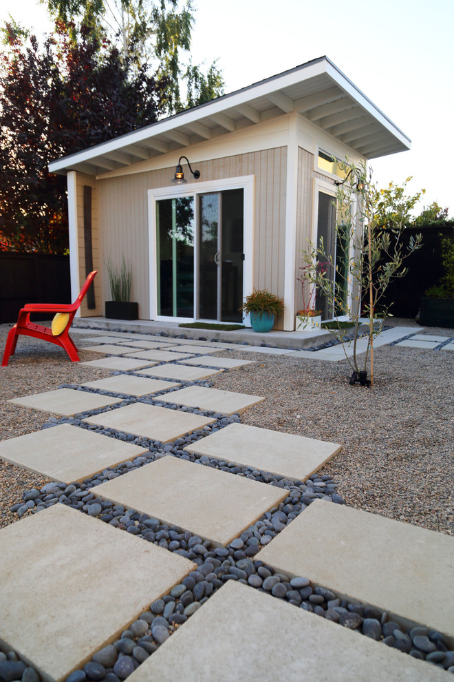 This is an example of a mid-sized modern backyard patio in San Luis Obispo with concrete pavers.