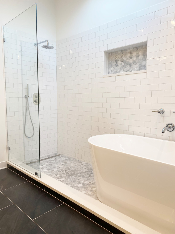 Design ideas for a large contemporary ensuite bathroom in Chicago with white cabinets, a freestanding bath, a walk-in shower, white tiles, metro tiles, engineered stone worktops, an open shower, grey worktops, double sinks, a freestanding vanity unit and a vaulted ceiling.