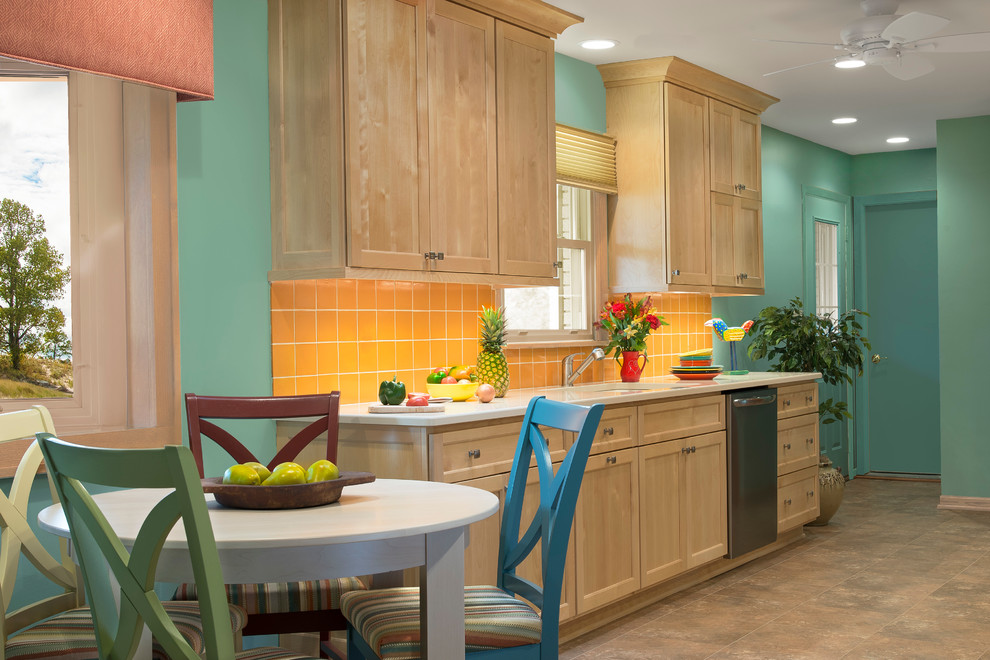 Large tropical galley eat-in kitchen in Milwaukee with an undermount sink, shaker cabinets, light wood cabinets, quartz benchtops, yellow splashback, terra-cotta splashback, stainless steel appliances, vinyl floors and no island.