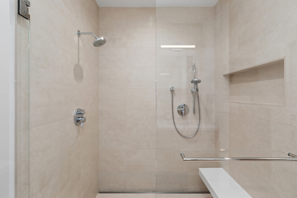Photo of a large modern master wet room bathroom in San Francisco with flat-panel cabinets, beige cabinets, an alcove tub, beige tile, ceramic tile, beige walls, ceramic floors, an undermount sink, engineered quartz benchtops, beige floor, a hinged shower door, white benchtops, a shower seat, a double vanity, a built-in vanity and wallpaper.