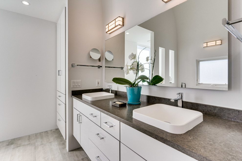 Large contemporary master bathroom in DC Metro with flat-panel cabinets, white cabinets, a corner shower, concrete benchtops, a hinged shower door, a niche, a double vanity and a floating vanity.