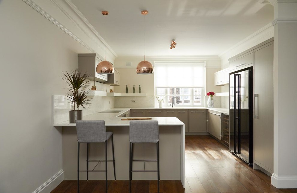 Inspiration for a mid-sized contemporary u-shaped open plan kitchen in London with grey cabinets, dark hardwood floors, no island and brown floor.
