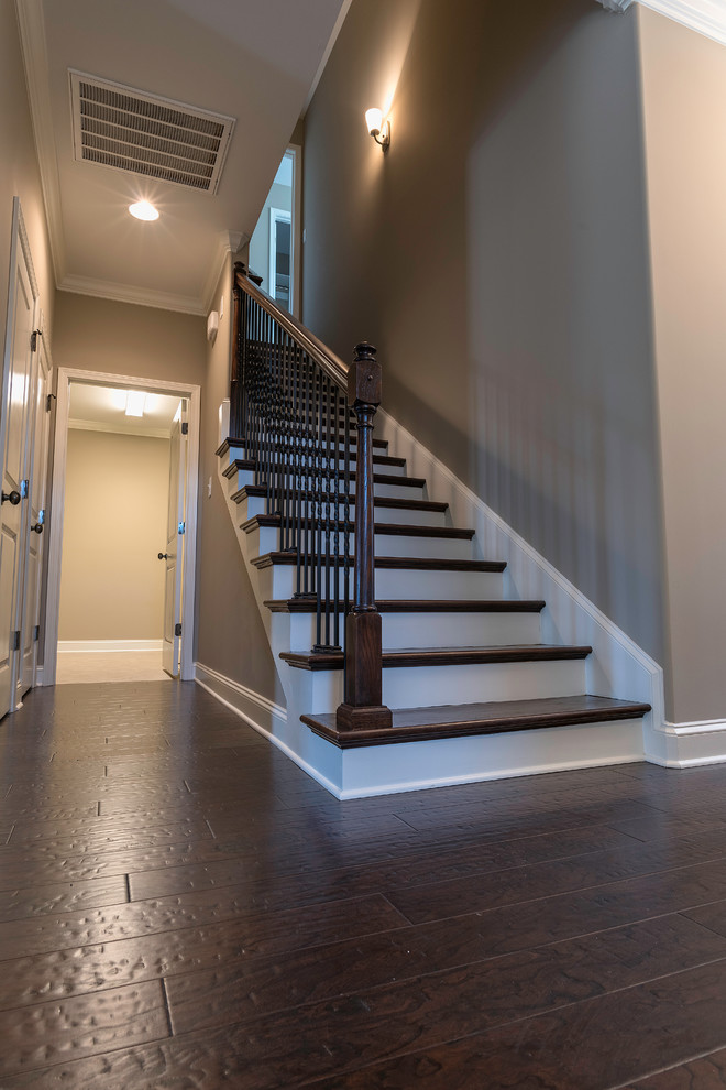 Mid-sized transitional wooden straight staircase photo with painted risers
