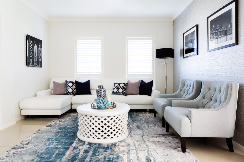 Inspiration for a transitional living room in Sydney with white walls, ceramic floors, no fireplace and beige floor.