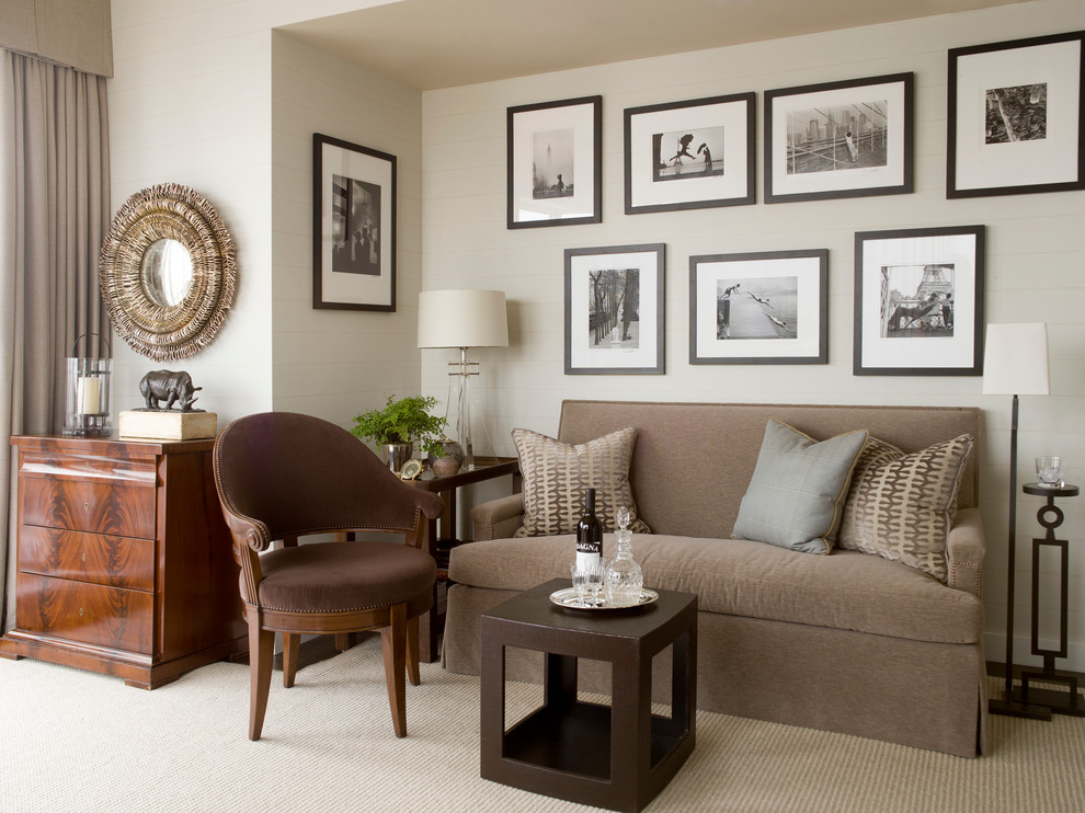 Photo of a transitional family room in New York with beige walls and carpet.