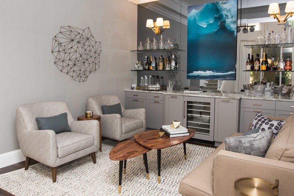 Photo of a transitional single-wall home bar in Miami with shaker cabinets, grey cabinets, no sink and mirror splashback.