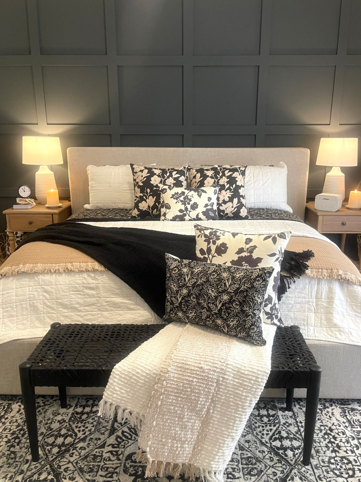 Design ideas for a transitional bedroom in Phoenix with black walls and panelled walls.