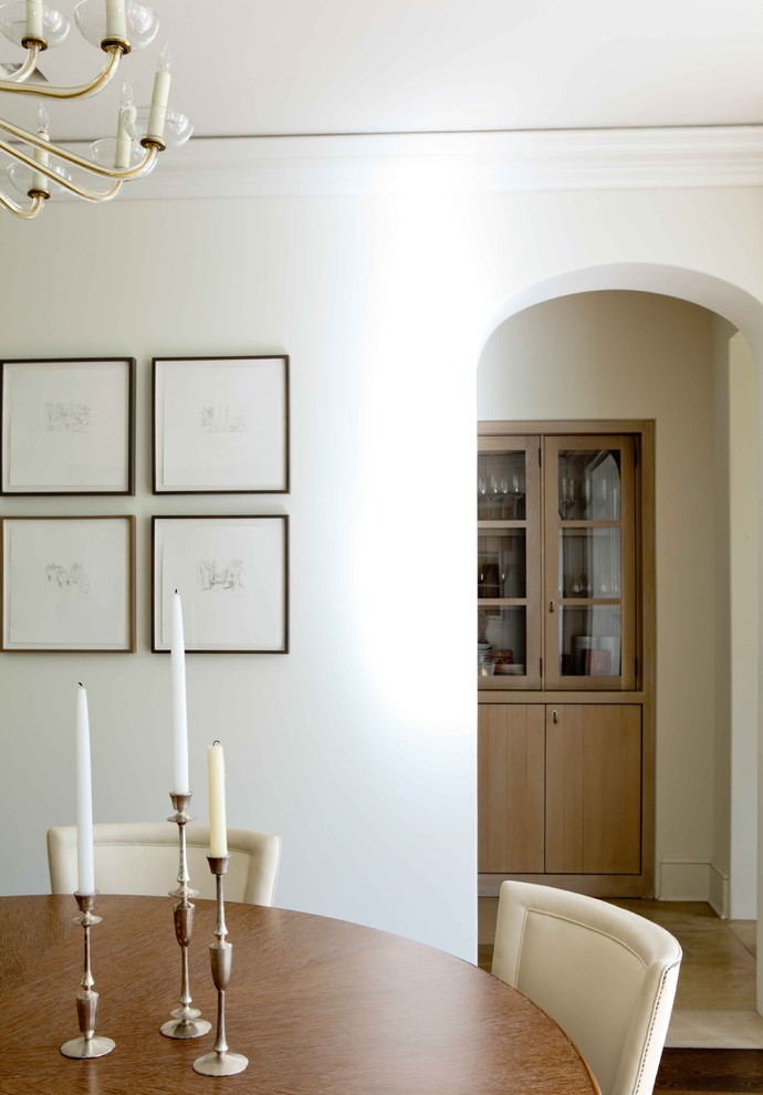 Photo of a transitional dining room in Los Angeles with white walls.