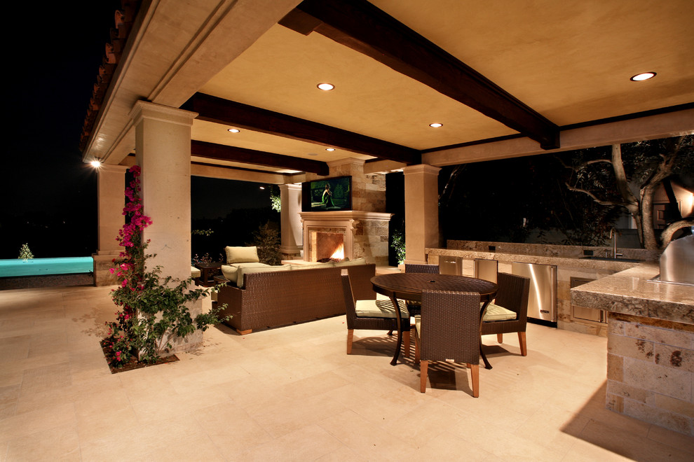 Inspiration for a mediterranean patio in Los Angeles with a gazebo/cabana and a fire feature.