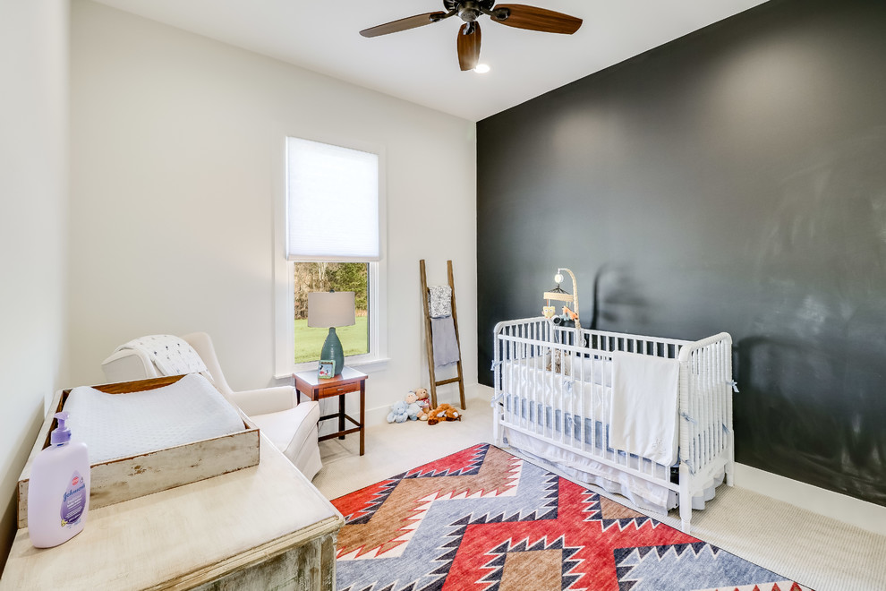 This is an example of a mid-sized country gender-neutral nursery in Jackson with white walls, carpet and beige floor.