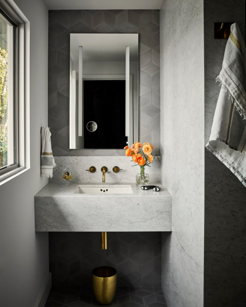 Example of a mid-sized mid-century modern master gray tile and marble tile ceramic tile, gray floor and single-sink bathroom design in Austin with gray cabinets, gray walls, a wall-mount sink, marble countertops, gray countertops and a built-in vanity