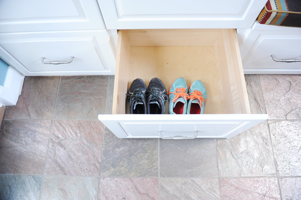 Example of a small transitional slate floor mudroom design in Baltimore with blue walls