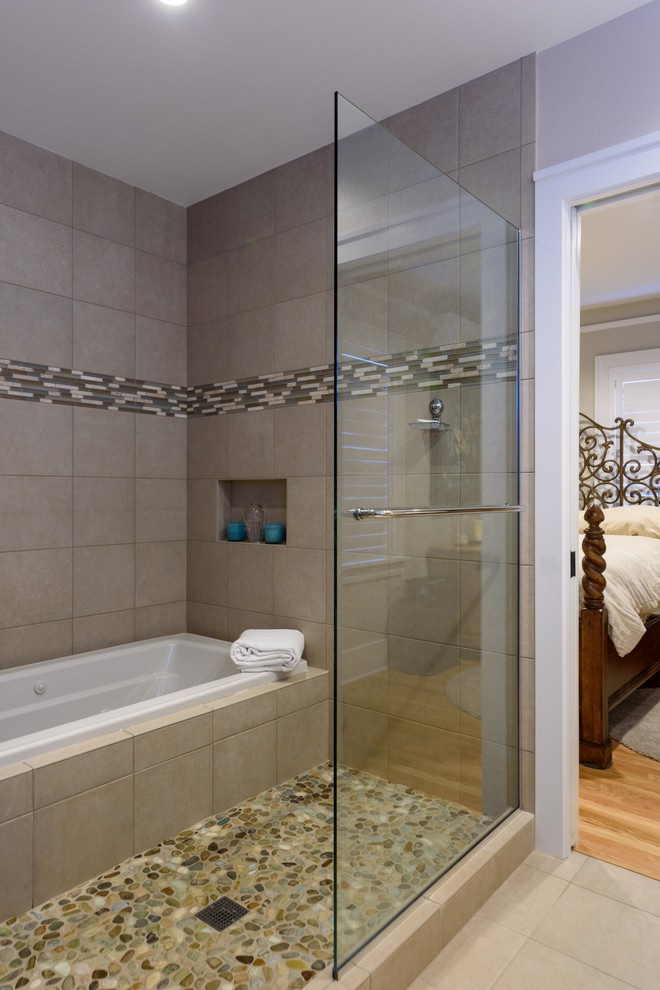 Design ideas for a mid-sized arts and crafts master wet room bathroom in Seattle with recessed-panel cabinets, white cabinets, a drop-in tub, a two-piece toilet, beige tile, pebble tile, beige walls, porcelain floors, a drop-in sink and quartzite benchtops.