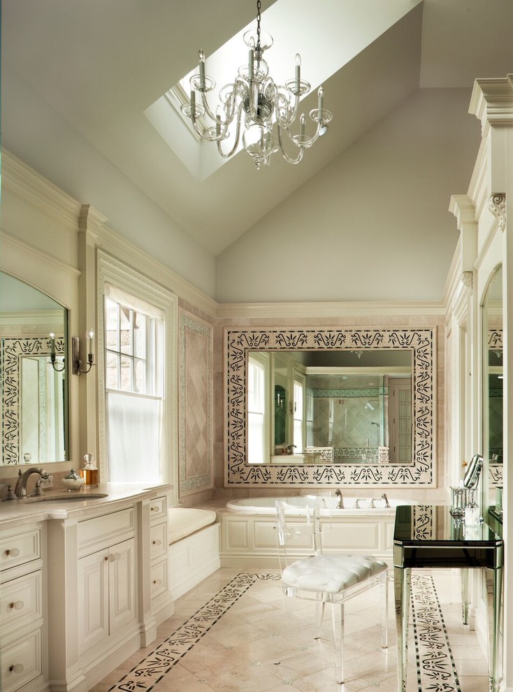 Large traditional master bathroom in Other with recessed-panel cabinets, beige cabinets, a drop-in tub, beige tile, beige walls, an undermount sink, porcelain tile, porcelain floors and engineered quartz benchtops.