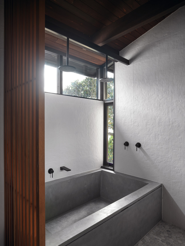 Design ideas for a large midcentury master bathroom in Sydney with flat-panel cabinets, dark wood cabinets, a japanese tub, a double shower, a one-piece toilet, white tile, ceramic tile, white walls, marble floors, a vessel sink, engineered quartz benchtops, grey floor, an open shower and grey benchtops.