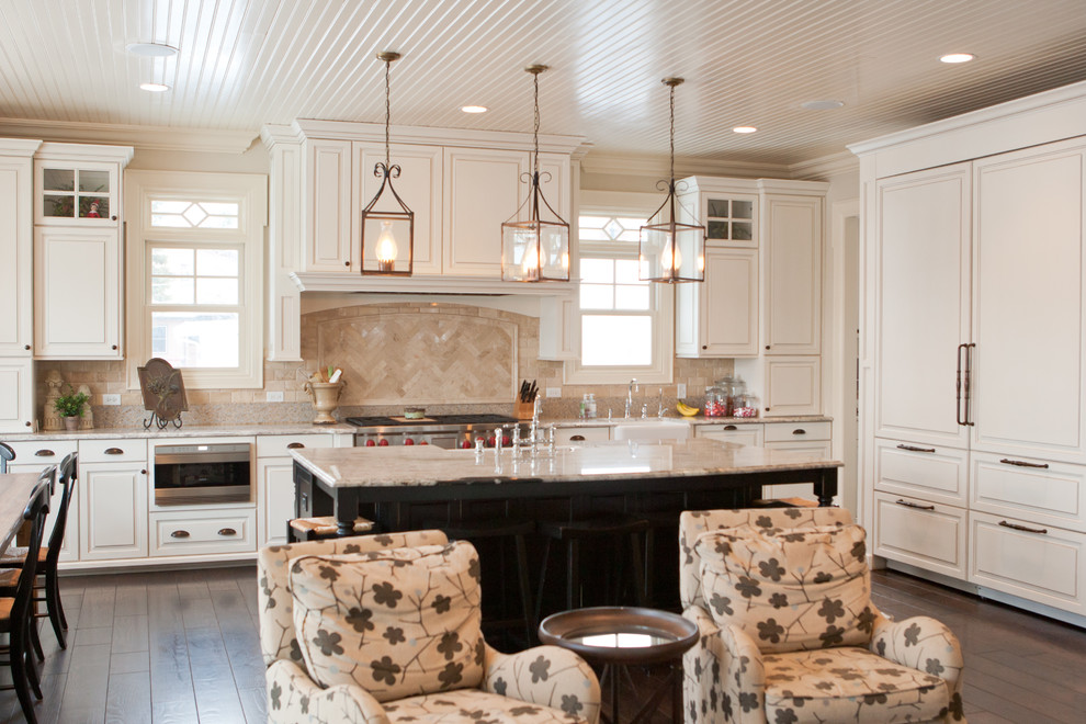 Inspiration for a large transitional single-wall dark wood floor eat-in kitchen remodel in Chicago with a drop-in sink, raised-panel cabinets, white cabinets, granite countertops, beige backsplash, ceramic backsplash, stainless steel appliances and an island