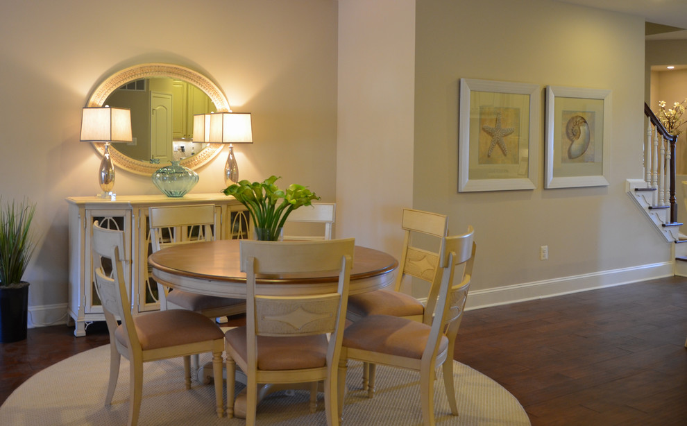 Photo of a beach style dining room in Other with white walls and medium hardwood floors.