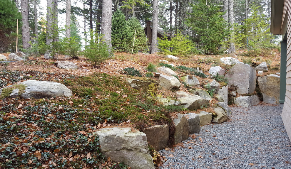 Inspiration for a transitional hillside retaining wall landscape.