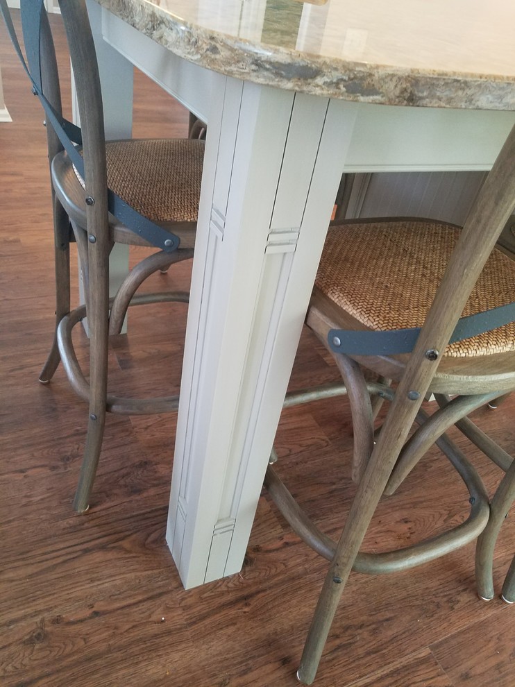 Inspiration for a large transitional l-shaped dark wood floor open concept kitchen remodel with an undermount sink, raised-panel cabinets, white cabinets, granite countertops, metallic backsplash, matchstick tile backsplash, stainless steel appliances and an island