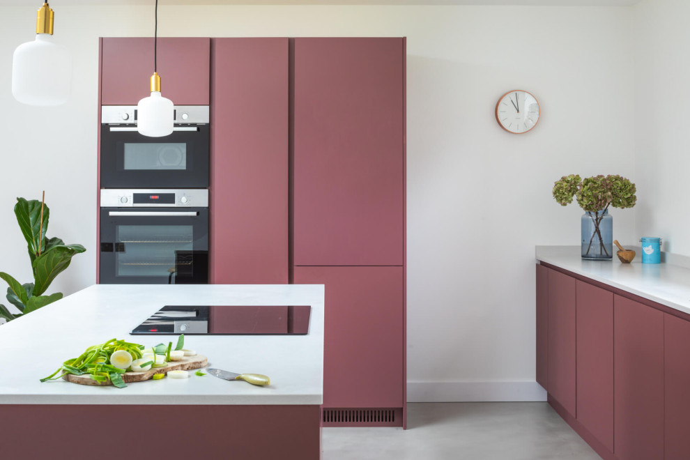 This is an example of a mid-sized contemporary l-shaped eat-in kitchen in Other with a drop-in sink, flat-panel cabinets, purple cabinets, quartzite benchtops, white splashback, concrete floors, with island, grey floor and white benchtop.