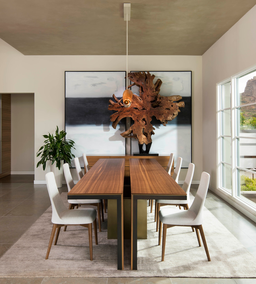 Photo of a contemporary dining room in Phoenix with limestone floors.