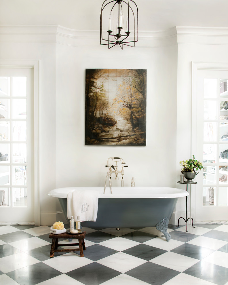 Traditional bathroom in Atlanta with a claw-foot tub, white walls and multi-coloured floor.