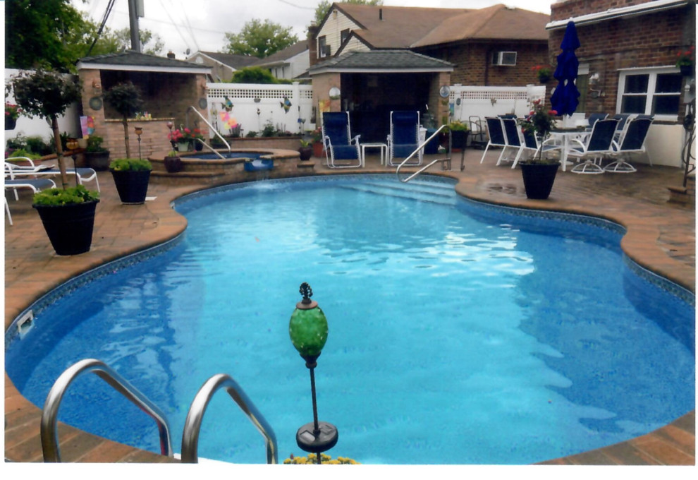 Pool with Whirl pool spill over, outdoor kitchen, outdoor bar, Pergola& Patio