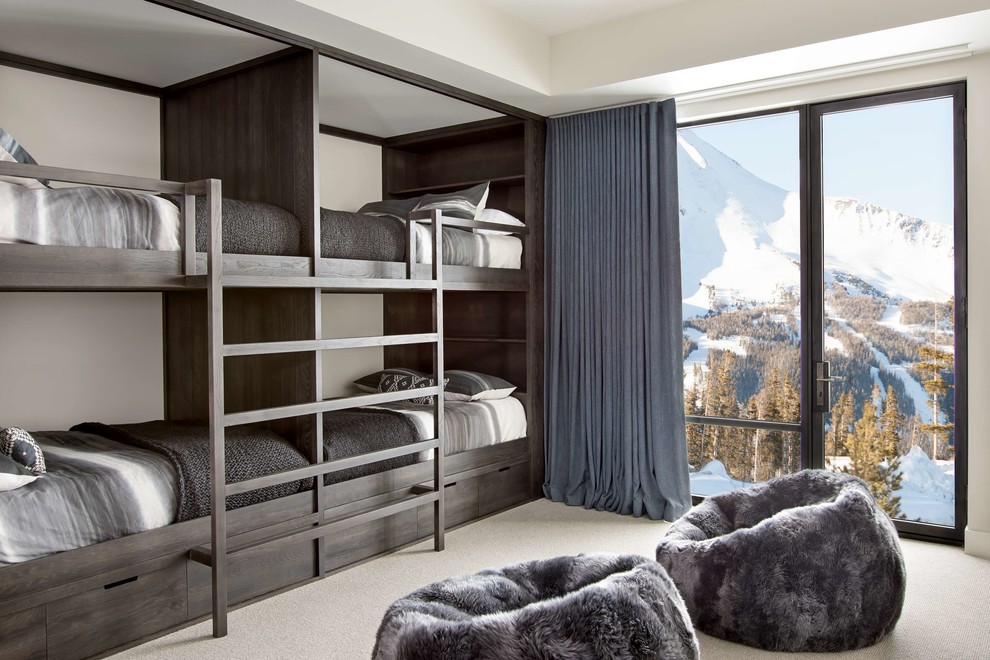 Kids' room - contemporary boy carpeted and beige floor kids' room idea in Other with beige walls