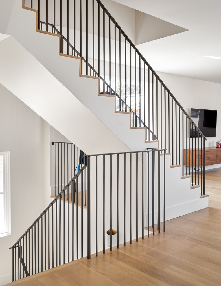 Staircase - large transitional wooden l-shaped metal railing staircase idea in Dallas with wooden risers