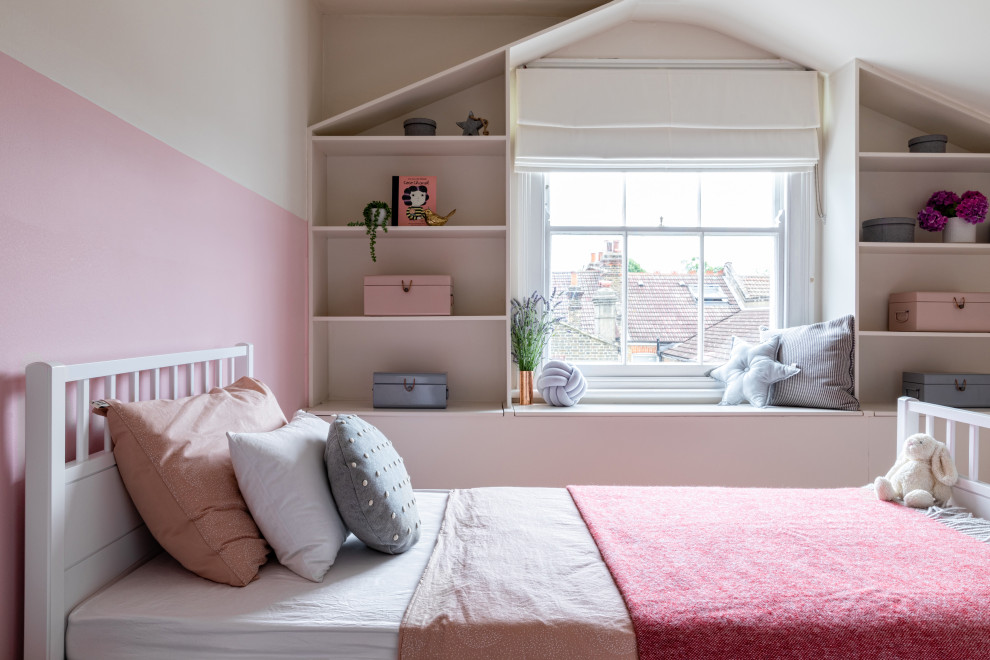 Small contemporary kids' bedroom in London with pink walls for kids 4-10 years old and girls.
