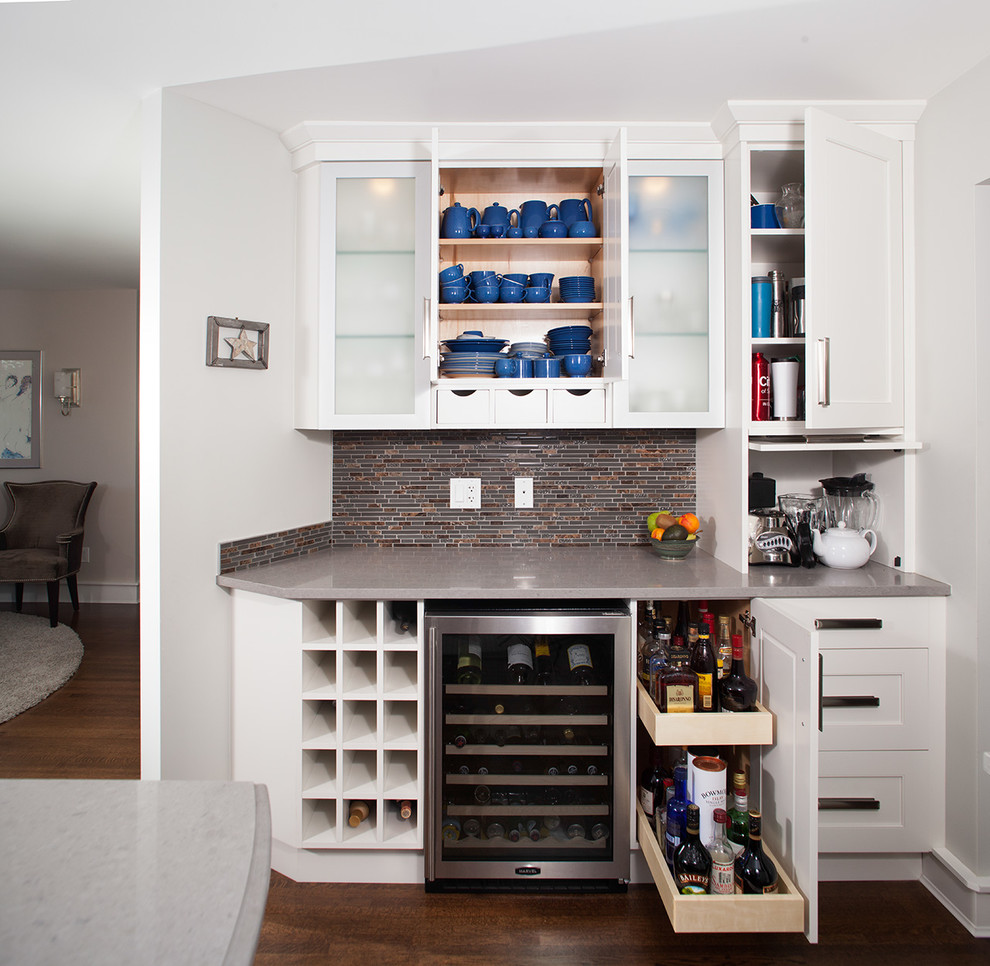 Example of a transitional home design design in Vancouver