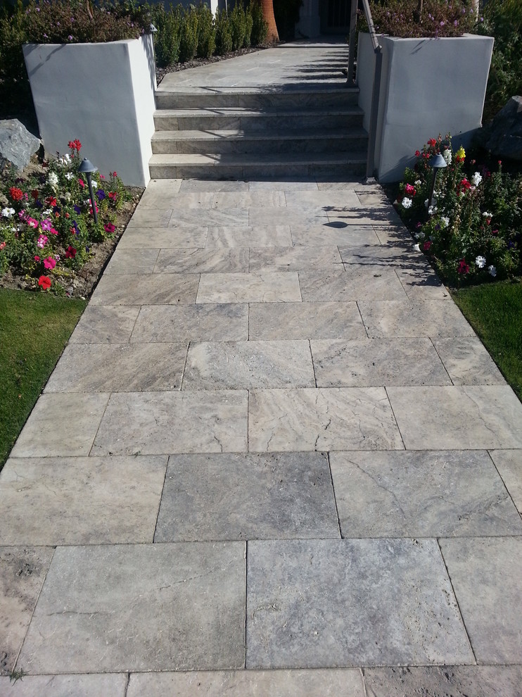 Inspiration for a large mediterranean courtyard garden in Portland with natural stone pavers.