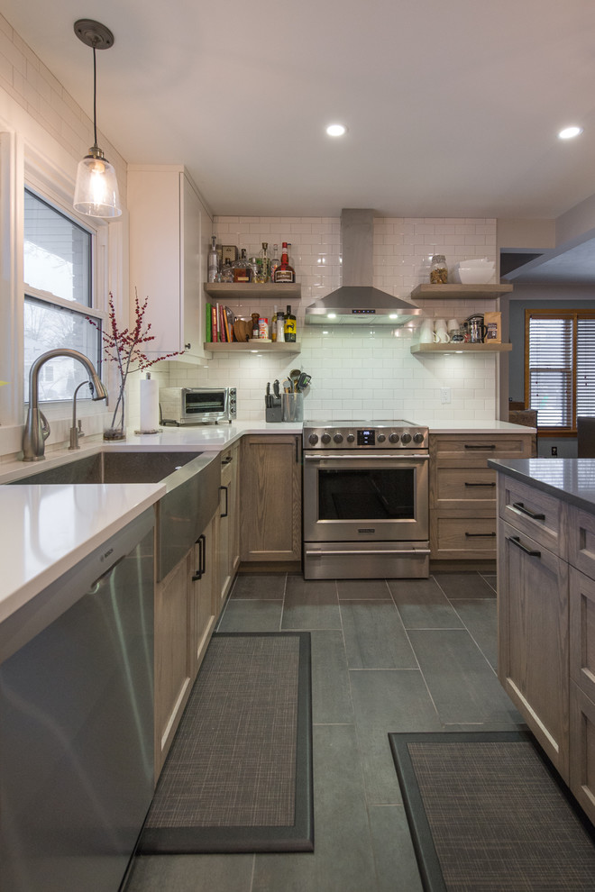 Design ideas for a small transitional l-shaped eat-in kitchen in Toronto with a farmhouse sink, shaker cabinets, light wood cabinets, quartzite benchtops, white splashback, porcelain splashback, stainless steel appliances, porcelain floors and with island.