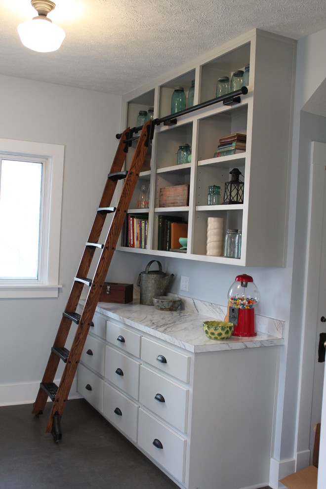 Mid-sized transitional single-wall medium tone wood floor kitchen pantry photo with flat-panel cabinets, white cabinets, quartz countertops and blue backsplash