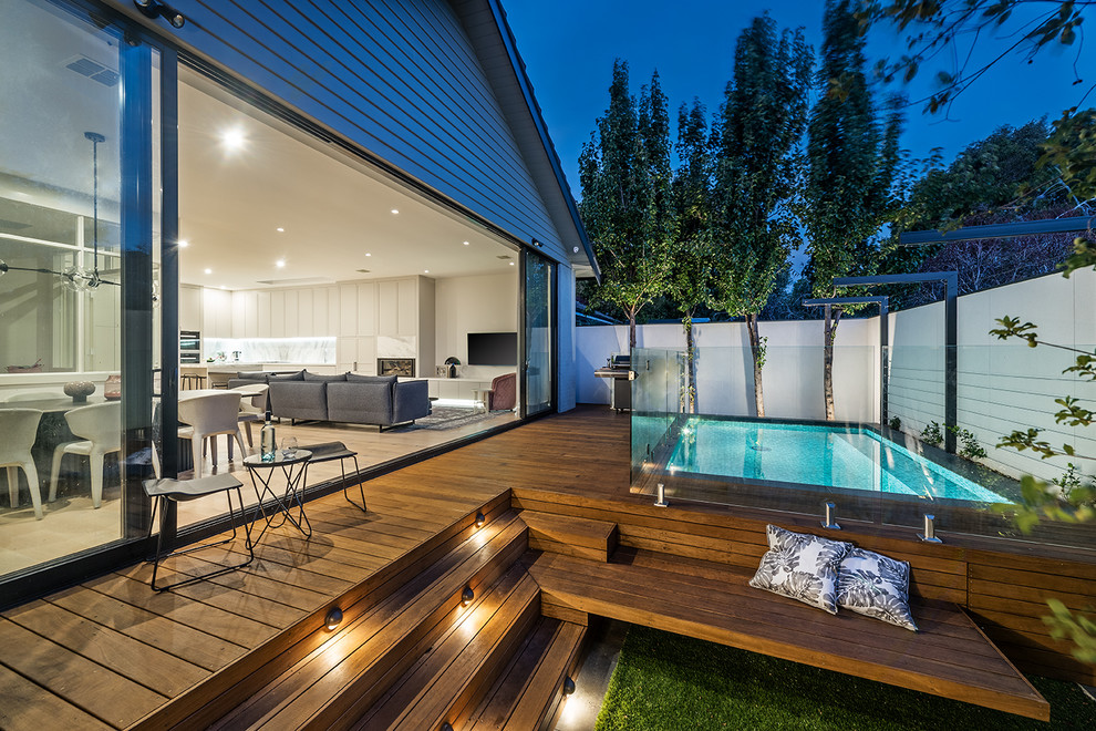Mid-sized contemporary backyard garden in Melbourne with decking.