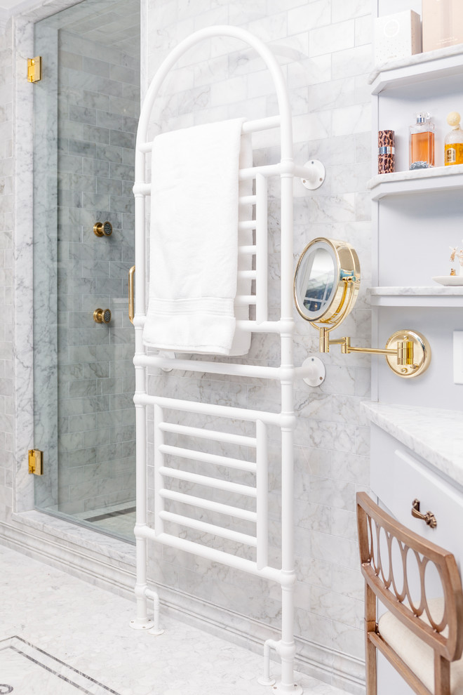 Design ideas for a mid-sized traditional master bathroom in Boston with a freestanding tub, an alcove shower, a one-piece toilet, gray tile, marble, blue walls, marble floors, an undermount sink, marble benchtops, grey floor, a hinged shower door and grey benchtops.
