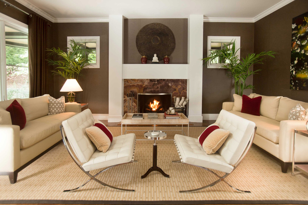 Inspiration for a large transitional formal enclosed living room in New York with brown walls, carpet, a standard fireplace, a stone fireplace surround and no tv.