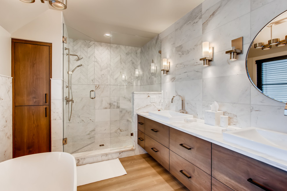 Contemporary master bathroom in Denver with dark wood cabinets, an alcove shower, white tile, beige walls, light hardwood floors, a hinged shower door, white benchtops, a shower seat, a double vanity, a floating vanity and flat-panel cabinets.