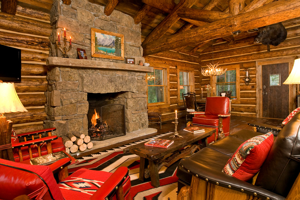 This is an example of a traditional living room in Denver with a standard fireplace and a stone fireplace surround.