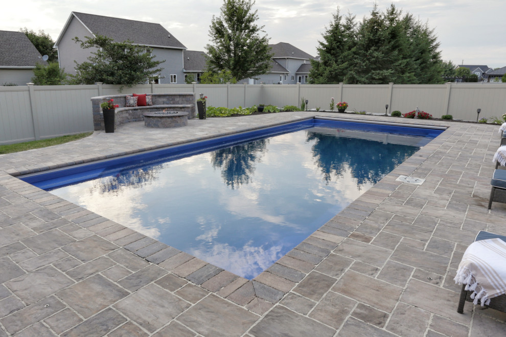 Mid-sized mountain style backyard stone privacy and full sun pool photo