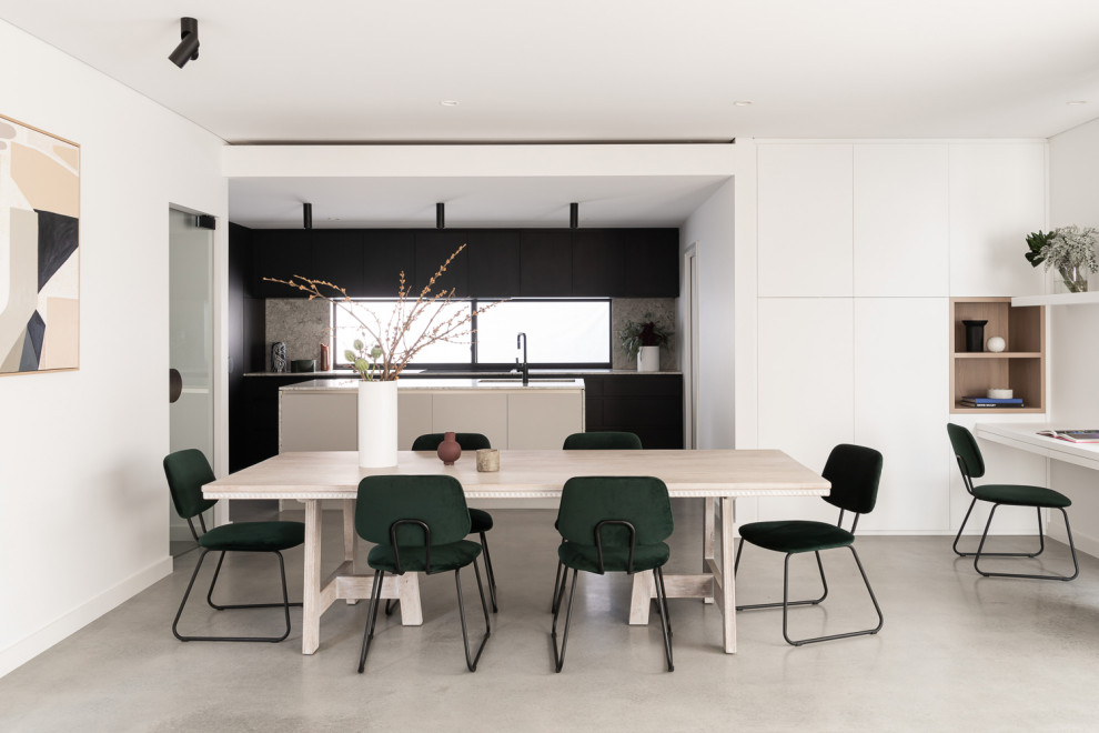 Inspiration for a mid-sized modern open plan dining in Perth with white walls, concrete floors and grey floor.