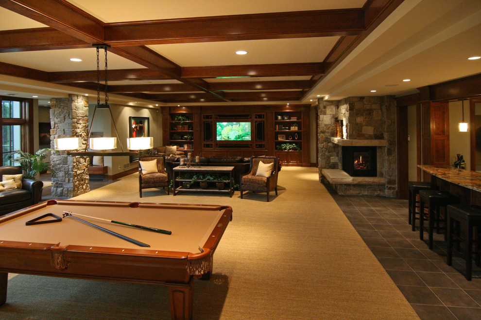 Traditional basement in Minneapolis with a standard fireplace and multi-coloured floor.