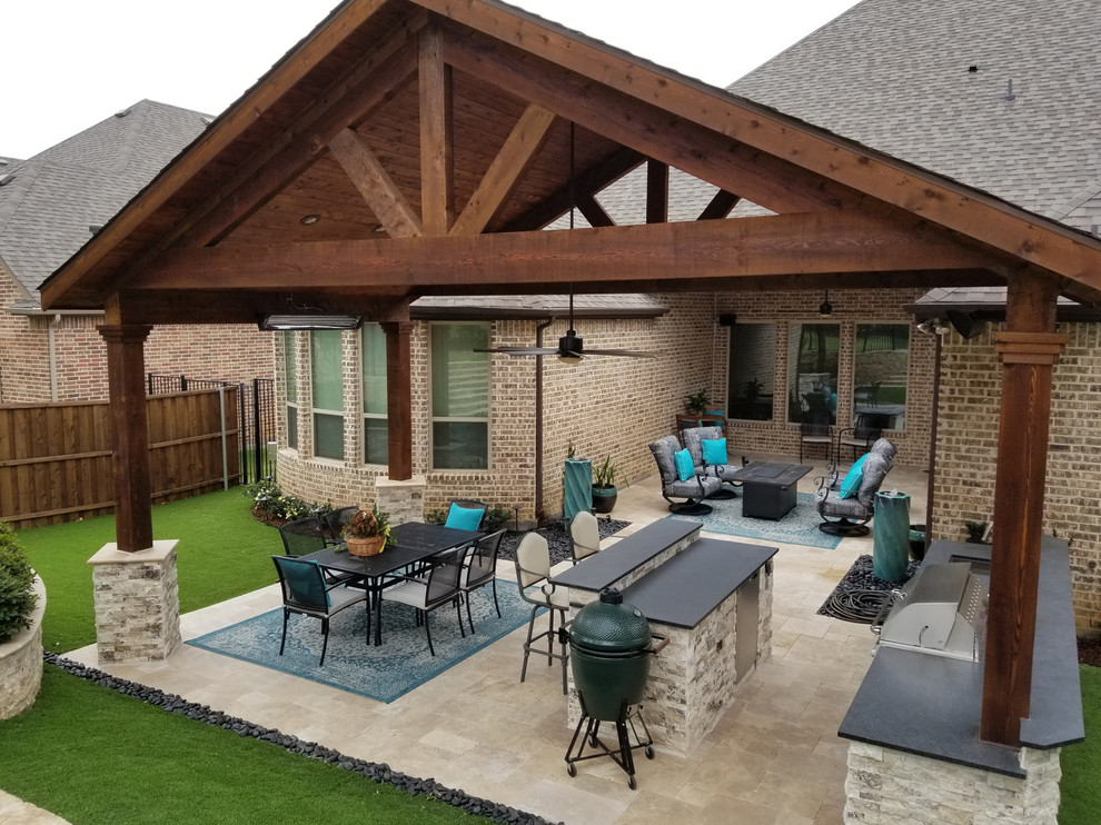 Design ideas for a large traditional backyard patio in Dallas with an outdoor kitchen, natural stone pavers and a gazebo/cabana.