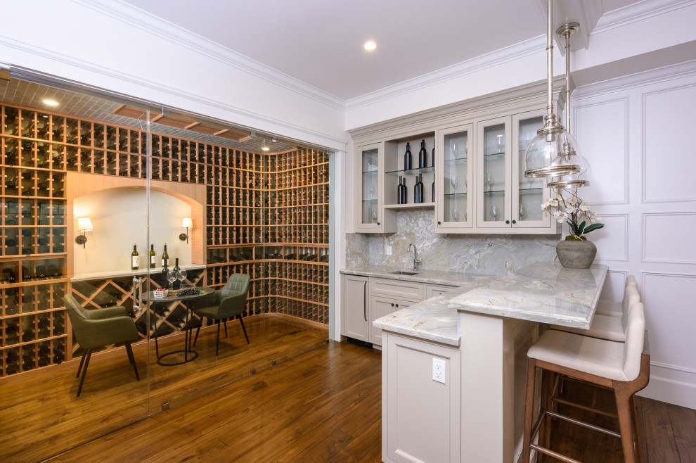 This is an example of a medium sized modern wine cellar in Los Angeles with medium hardwood flooring, storage racks, brown floors and a feature wall.