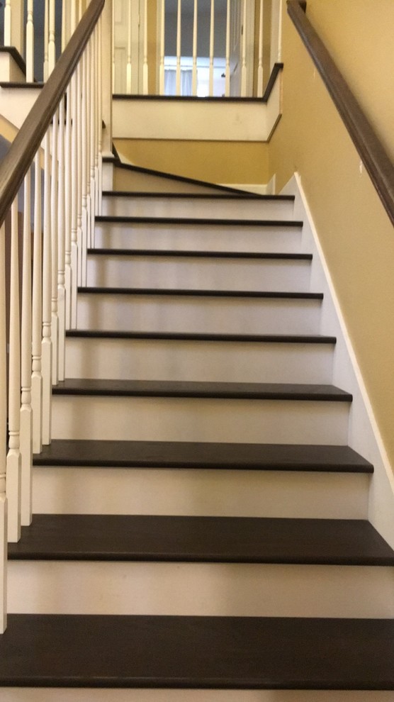 Staircase - mid-sized transitional wooden l-shaped wood railing staircase idea in Orlando with painted risers