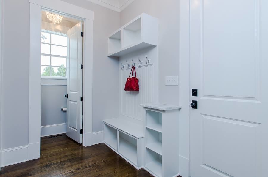 Inspiration for a small transitional dark wood floor and brown floor front door remodel in Raleigh with gray walls and a white front door